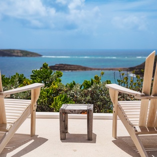Panoramic coastal vista featuring turquoise waters, small islands, and lush coastal vegetation—defining the scenic area surrounding this vacation rental property.
