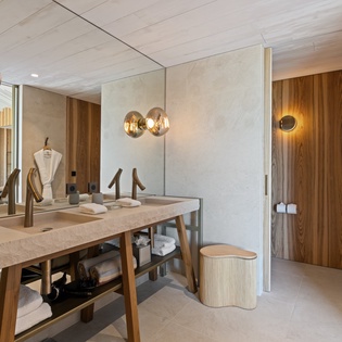 Luxurious bathroom with sleek design, warm wood tones, and spa-like amenities for your ultimate relaxation.