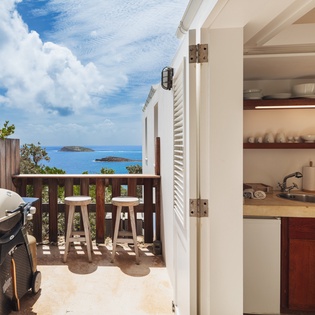 Open up to stunning ocean views from your private terrace. With a fully equipped kitchenette and BBQ grill steps away, island living is effortlessly yours to enjoy.