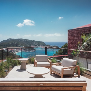 Unwind in your private terrace sanctuary with stunning ocean views stretching to the horizon.