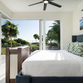 Wake up to tropical breezes and lush palm views from your private sanctuary, where crisp linens meet ocean-inspired comfort.