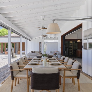 Gather around this elegant outdoor dining area, where your meals are framed by tropical breezes and resort-style architecture—perfect for relaxed breakfasts or sunset dinners.