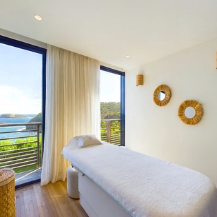 Unwind with coastal views during your massage as ocean breezes flow through open windows.