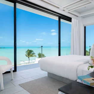 Wake up to sweeping turquoise waters right outside your window, where modern elegance meets paradise and every morning feels like a dream come true.
