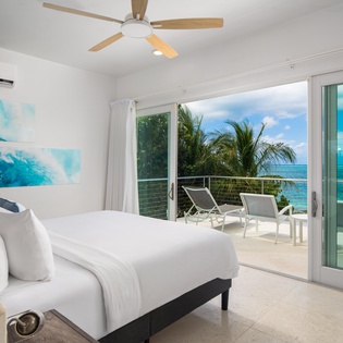 Wake up to breathtaking ocean views from your bright bedroom, where tropical breezes flow through sliding doors to your private balcony.