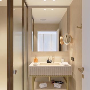 Refresh in your elegant marble bathroom with rain shower, luxury toiletries, and thoughtful amenities at your fingertips.
