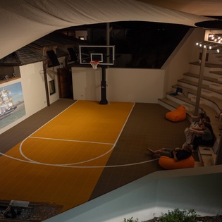 Your private basketball court with stadium seating creates the perfect space for friendly games and entertainment.