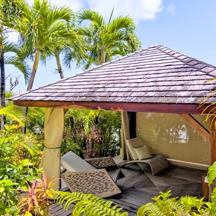 Unwind in your private garden cabana, surrounded by swaying palms and tropical blooms. Stretch out on plush lounge chairs with ocean breezes and total relaxation just steps away.