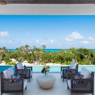 Unwind in your private infinity pool terrace with sweeping ocean views and elegant outdoor seating.