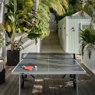 Challenge friends to ping pong matches on your private tropical terrace, surrounded by swaying palms and lush greenery.