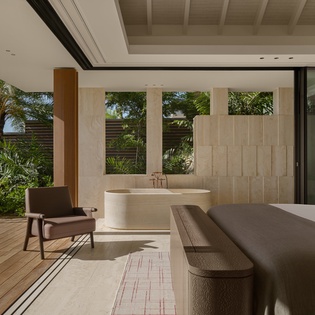 Unwind in your luxurious suite where modern comfort meets tropical serenity, featuring a spa-like soaking tub overlooking lush gardens.