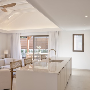 Your sleek kitchen island becomes the heart of this bright, open space where you'll cook and connect effortlessly.