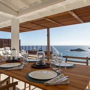 Dine al fresco on your private terrace where stunning sea views accompany every meal, creating unforgettable moments.