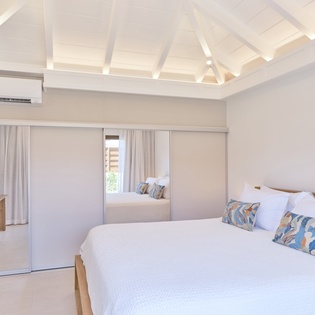 Rest peacefully in your bright bedroom with stunning exposed beam ceiling and crisp linens awaiting your arrival.