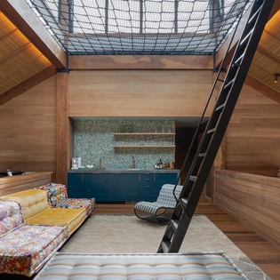 Unwind in this stunning loft with soaring ceilings, natural light streaming through skylights, and a cozy living area perfect for relaxation.