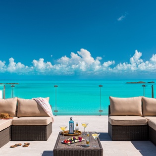 Sip your morning cocktail from this stunning oceanfront terrace, where turquoise waters and endless skies create your private paradise. Pure bliss awaits.