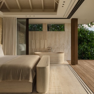 Indulge in your own private spa sanctuary where luxurious soaking and restful sleep blend seamlessly with tropical garden views.