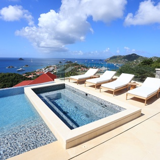 Private infinity pool with panoramic Caribbean views and luxury loungers for your ultimate relaxation retreat.