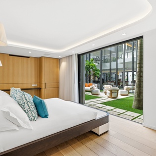 Wake up to serene garden views from your luxurious bedroom, where modern comfort meets tranquil outdoor spaces.