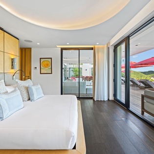 Your private suite opens to mountain views, blending luxury comfort with stunning outdoor terraces for the perfect escape.