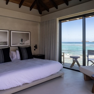 Wake up to endless ocean views from your bed, where the sea meets your room through floor-to-ceiling windows.