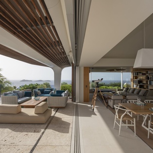 Your spacious retreat seamlessly blends indoor comfort with tropical tranquility, offering panoramic ocean views from every angle.