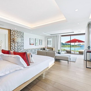 Your spacious suite combines luxury comfort with stunning ocean vistas, featuring crisp linens and modern design.