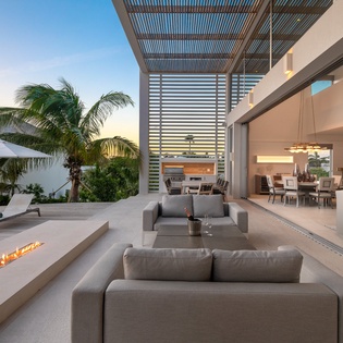 Luxurious outdoor living unfolds where modern design meets tropical paradise, with elegant seating overlooking your private pool.