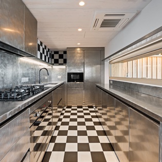 Your sleek stainless steel kitchen offers professional-grade appliances and ample counter space for culinary adventures.