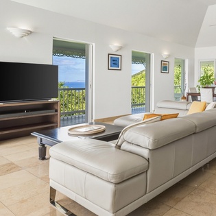 Relax in your open-plan living space where ocean breezes flow through French doors onto your private balcony.