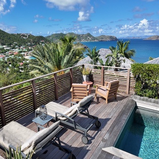 Soak in breathtaking views from your private pool deck overlooking turquoise waters and tropical islands—pure Caribbean paradise awaits.
