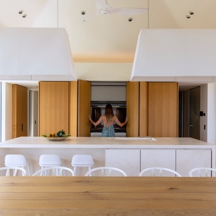 Your gourmet kitchen awaits with sleek marble island, premium appliances, and stylish seating for memorable meals together.