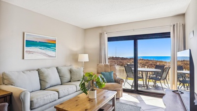 Ocean Breeze West Unit 103 Living Room and Beach Patio