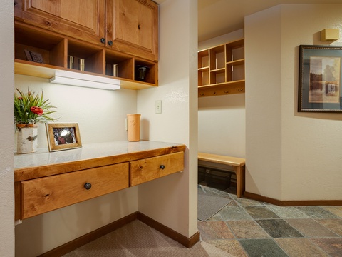 Your personal workspace awaits with warm wood cabinetry, built-in storage, and a welcoming nook where you can catch up on emails or plan tomorrow's adventure.