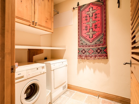Your own in-unit washer and dryer make it easy to freshen up after mountain adventures, with charming wooden cabinetry for all your supplies.