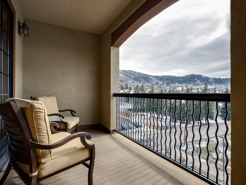 Settle into your private balcony with plush seating and take in peaceful mountain views—your perfect retreat for morning coffee or evening relaxation.