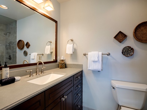 Fresh towels and thoughtful touches await you in this pristine bathroom, where natural light and artisan details create a spa-like retreat for your daily refresh.