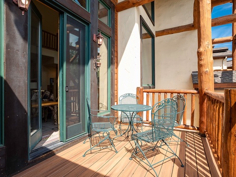 Step outside onto your private balcony, where rustic wood beams frame open skies. Sip morning coffee at your bistro table, feeling the sun warm your face as fresh mountain air surrounds you.