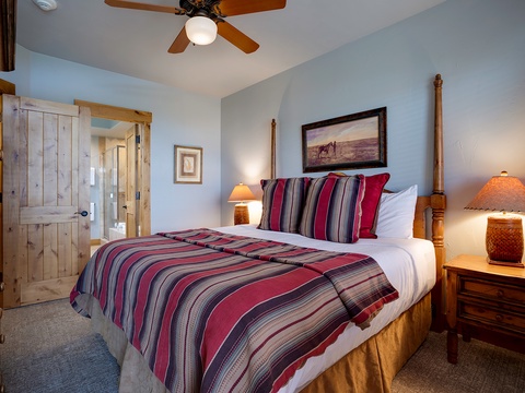Unwind in your cozy retreat with a handcrafted four-poster bed, warm southwestern accents, and gentle overhead fan keeping you comfortable year-round.