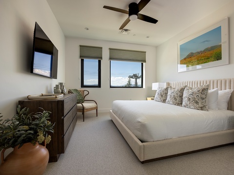 Slip into crisp white linens and let the gentle ceiling fan keep you cool as natural light pours through your windows. Wake refreshed in this thoughtfully appointed bedroom, your peaceful retreat after a day of exploring.