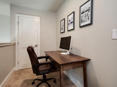 Your dedicated workspace awaits with a comfortable desk, ergonomic chair, and all the essentials to stay productive during your stay.