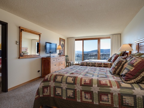 Drift off in cozy quilted comfort while mountain views greet you each morning through your private balcony doors, making every moment of your stay peaceful and memorable.