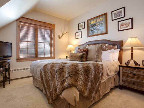 Sink into plush textures and warm Western charm in your cozy retreat. Soft lighting and rustic details create the perfect atmosphere for restful mountain nights.