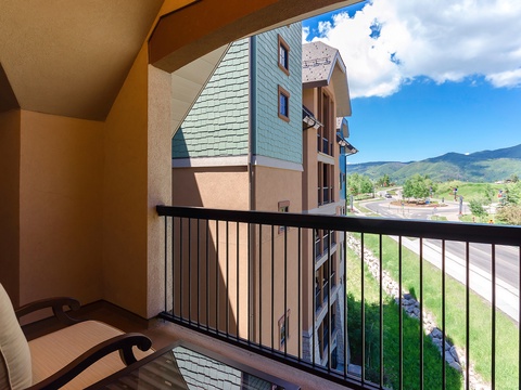 Relax on your private balcony and take in stunning mountain views framed by blue skies. Fresh mountain air and peaceful scenery set the stage for your perfect retreat.