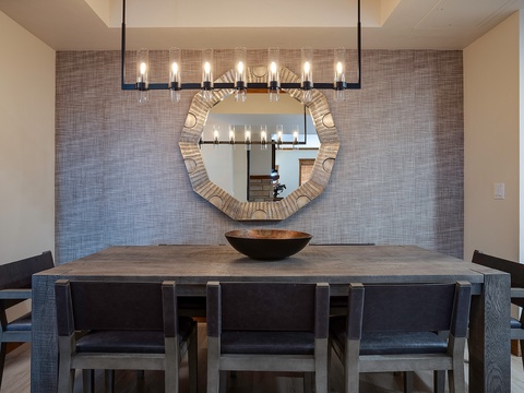 Modern dining space with sleek furnishings and ambient lighting sets the stage for memorable gatherings. You'll appreciate the sophisticated design and comfortable seating for shared meals.