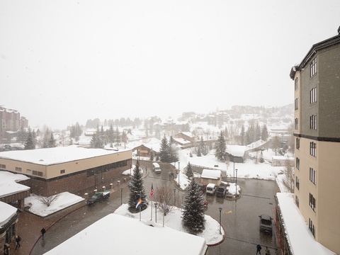 A snow-dusted mountain village nestled among evergreens, where winter charm meets alpine tranquility. The property is centrally located in this scenic ski-town setting.