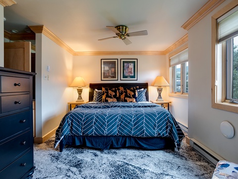 Wake up refreshed in your cozy bedroom, where plush bedding and mountain views create the perfect alpine retreat. Natural light streams through large windows, welcoming each new day.