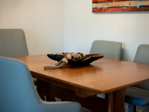 Gather around your spacious dining table, where thoughtful touches and comfortable seating invite you to share meals and stories together during your stay.
