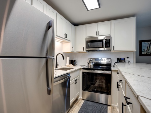Your fully equipped kitchen features marble countertops, stainless appliances, and all the tools you'll need to prepare delicious home-cooked meals during your stay.