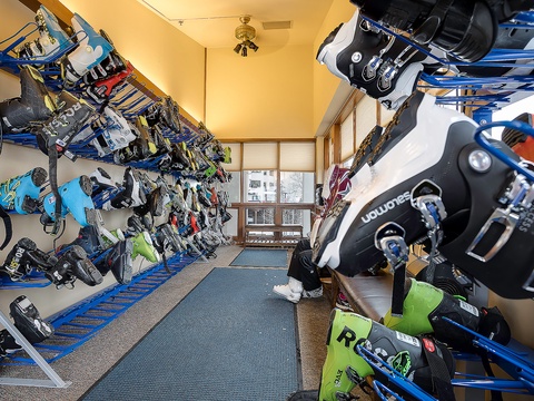 A dedicated ski and snowboard storage room keeps your winter gear organized and ready for the slopes, with ample space for equipment and boots.